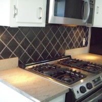 Black tile backsplash kitchen