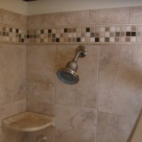 Porcelain shower with mosaic accents